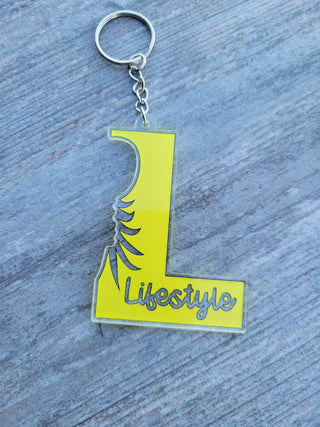 Lifestyle Keychain / Zipper Pull with the letter L, Lifestyle, and an outline of an upside down pineapple, Alternative Lifestyle Keychain