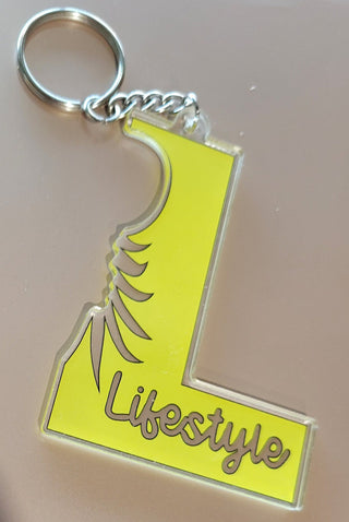 Lifestyle Keychain / Zipper Pull with the letter L, Lifestyle, and an outline of an upside down pineapple, Alternative Lifestyle Keychain